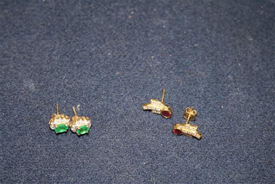 A pair of 14ct gold, emerald and diamond earrings and a pair of 18ct gold, ruby and diamond earrings